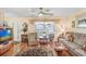 Cozy living room featuring hardwood floors and natural light at 7703 W Hiawatha St, Tampa, FL 33615