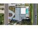 Bird's eye view of home, highlighting the pool, patio, lush backyard, and circular driveway at 7919 Causeway S Blvd, St Petersburg, FL 33707