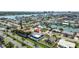 Waterfront living featuring a well-manicured lawn, sparkling pool and easy access to intercoastal waters at 7919 Causeway S Blvd, St Petersburg, FL 33707
