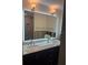 Elegantly renovated bathroom features a double sink vanity with marble countertops and a decorative backsplash at 7919 Causeway S Blvd, St Petersburg, FL 33707