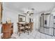 Inviting dining area with a ceiling fan and modern dining set for four at 8115 N Ola Ave, Tampa, FL 33604