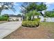 Charming single-story home featuring a well-maintained lawn and driveway at 8115 N Ola Ave, Tampa, FL 33604