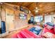 The home includes a sunroom with wooden walls, tile flooring, and lots of natural light at 8115 N Ola Ave, Tampa, FL 33604
