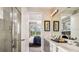 This luxurious bathroom features a walk-in shower, dual sinks, and plenty of counter space at 819 Steel Dr, Apollo Beach, FL 33572