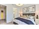 Well-decorated bedroom with closet access, featuring a plush bed and contemporary artwork at 821 Steel Dr, Apollo Beach, FL 33572