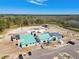 Construction site of a clubhouse with modern design elements and a pool area at 8953 Gallantree Pl, Land O Lakes, FL 34637
