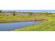 Enjoy the tranquil view of the lake from this well-maintained backyard space at 8953 Gallantree Pl, Land O Lakes, FL 34637