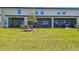 Spacious backyard featuring a screened-in patio and ample space for outdoor activities at 8953 Gallantree Pl, Land O Lakes, FL 34637
