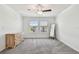Sunlit bedroom with large windows and a neutral color palette at 8953 Gallantree Pl, Land O Lakes, FL 34637