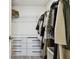 Walk-in closet with custom shelving and drawers for organized storage at 8953 Gallantree Pl, Land O Lakes, FL 34637