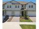 Charming townhomes with individual garages, paver driveways and well-maintained lawns at 8953 Gallantree Pl, Land O Lakes, FL 34637