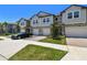 Inviting townhome boasting a brick driveway, manicured lawn, private garage, and a lovely entrance at 8953 Gallantree Pl, Land O Lakes, FL 34637