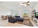 Bright living room with neutral colors, comfortable seating, and plenty of natural light at 8953 Gallantree Pl, Land O Lakes, FL 34637