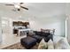 Spacious living room seamlessly connected to the kitchen with comfortable seating and bright natural light at 8953 Gallantree Pl, Land O Lakes, FL 34637