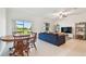 Open-concept living room with a large window and a view of the backyard at 8953 Gallantree Pl, Land O Lakes, FL 34637