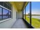 Relax on this screened patio offering serene views of the lake and beautifully landscaped surroundings at 8953 Gallantree Pl, Land O Lakes, FL 34637