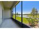 Enjoy scenic views of the lake from this screened patio; ideal for tranquil outdoor living at 8953 Gallantree Pl, Land O Lakes, FL 34637