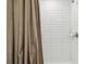 Modern shower with white subway tile and a sleek shower curtain at 8953 Gallantree Pl, Land O Lakes, FL 34637