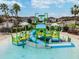 View of a colorful splash pad with slides and water features in the Connerton community at 8953 Gallantree Pl, Land O Lakes, FL 34637