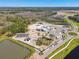Aerial view of community under construction with various amenities, including a pool and recreation area at 8953 Gallantree Pl, Land O Lakes, FL 34637