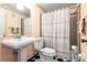 Neat bathroom featuring pedestal sink, toilet, and shower with tub in a patterned design at 101 Dogwood Cir, Seminole, FL 33777