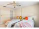 Bedroom featuring two twin beds, bright linens, and comfortable lighting fixture at 101 Dogwood Cir, Seminole, FL 33777