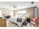 Comfortable bedroom featuring neutral colors, ceiling fan, and lots of natural light at 101 Dogwood Cir, Seminole, FL 33777