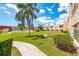 Picturesque community featuring lush landscaping, a swimming pool, and well-maintained buildings at 101 Dogwood Cir, Seminole, FL 33777