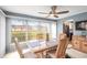 Charming dining area featuring ample natural light, a ceiling fan, and views of the outdoors at 101 Dogwood Cir, Seminole, FL 33777