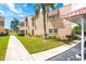 Charming two-story condo with lush landscaping and carport in a vibrant community at 101 Dogwood Cir, Seminole, FL 33777