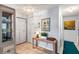 Bright foyer featuring tile flooring, closet, and a console table with decor at 101 Dogwood Cir, Seminole, FL 33777