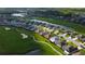 Community aerial view featuring well-maintained homes along a golf course and ponds at 10103 Old Tampa Bay Dr, San Antonio, FL 33576