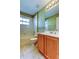 Bright bathroom showcases a vanity and shower-tub combination at 10103 Old Tampa Bay Dr, San Antonio, FL 33576