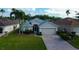 Charming single-story home featuring a two-car garage, mature landscaping, and a brick paved driveway at 10103 Old Tampa Bay Dr, San Antonio, FL 33576