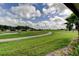 Picturesque golf course and walking path with lush greenery and clear water at 10103 Old Tampa Bay Dr, San Antonio, FL 33576