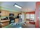Well-lit kitchen with granite countertops, stainless steel appliances, and light wood cabinets at 10103 Old Tampa Bay Dr, San Antonio, FL 33576