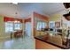 Well-appointed kitchen featuring a breakfast nook, granite countertops, and stainless steel sink at 10103 Old Tampa Bay Dr, San Antonio, FL 33576