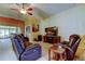 Cozy living area with leather recliners and entertainment center, perfect for relaxation at 10103 Old Tampa Bay Dr, San Antonio, FL 33576