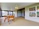 Covered patio featuring ceiling fans and ample seating space for entertaining at 10103 Old Tampa Bay Dr, San Antonio, FL 33576