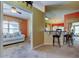 Bright sitting area features a white sofa, view of the breakfast bar, and natural light at 10103 Old Tampa Bay Dr, San Antonio, FL 33576