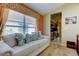 Comfortable sitting area with decorative pillows and a view into the kitchen at 10103 Old Tampa Bay Dr, San Antonio, FL 33576