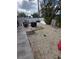 Backyard featuring a gravel area with some miscellaneous yard debris and equipment at 1021 Estremadura Dr, Bradenton, FL 34209