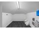 Unfinished attic space featuring carpeting and a water heater at 1058 Roundstone Pl, Palm Harbor, FL 34683