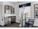 Bar area with mini fridge and bar stools at 1058 Roundstone Pl, Palm Harbor, FL 34683