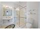 Bathroom featuring a glass shower and modern fixtures at 1058 Roundstone Pl, Palm Harbor, FL 34683