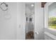 Bathroom with a shower and window overlooking the yard at 1058 Roundstone Pl, Palm Harbor, FL 34683