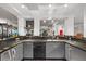 Modern home gym featuring sleek countertops, storage, a sink and mirrors at 1058 Roundstone Pl, Palm Harbor, FL 34683