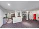 Spacious home gym with a variety of exercise equipment and a red punching bag at 1058 Roundstone Pl, Palm Harbor, FL 34683