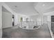 Second floor hallway features a curved railing that overlooks the living room at 1058 Roundstone Pl, Palm Harbor, FL 34683