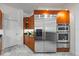 Gourmet kitchen featuring stainless steel appliances, granite countertops, and custom cabinetry at 1058 Roundstone Pl, Palm Harbor, FL 34683